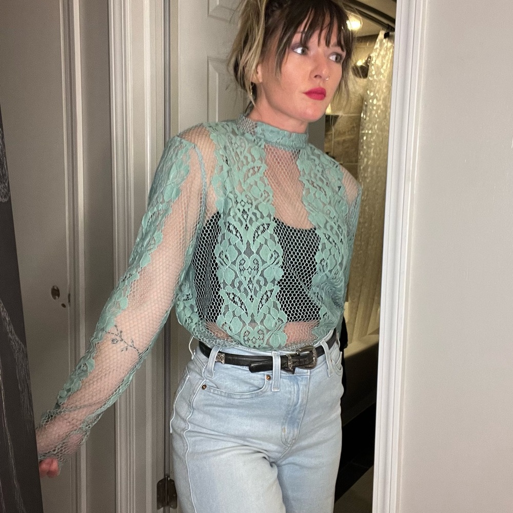 Long sleeve lace top. Really pretty sea foam green color. Dress up or down!